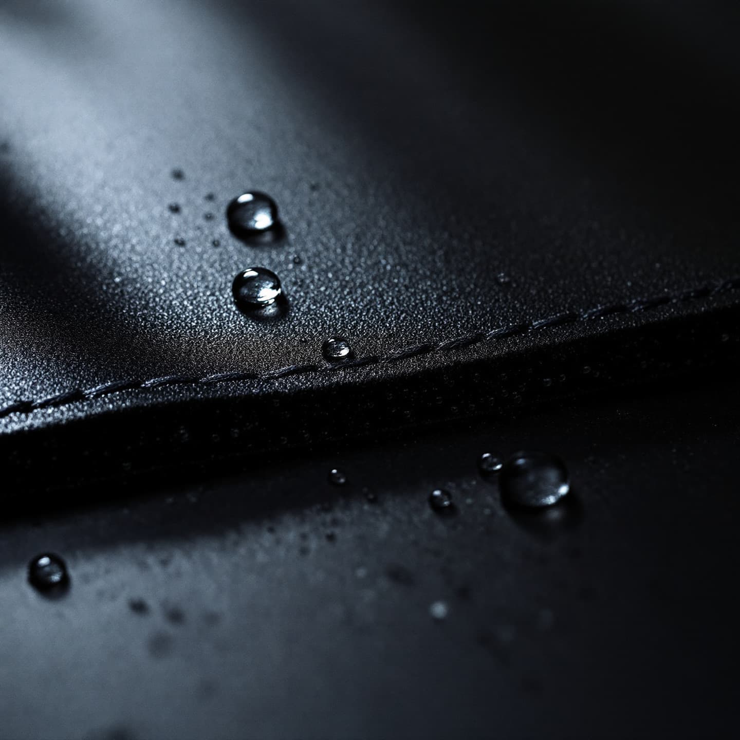 The cut edge of recycled neoprene: a smooth sealed skin over a dense closed-cell core